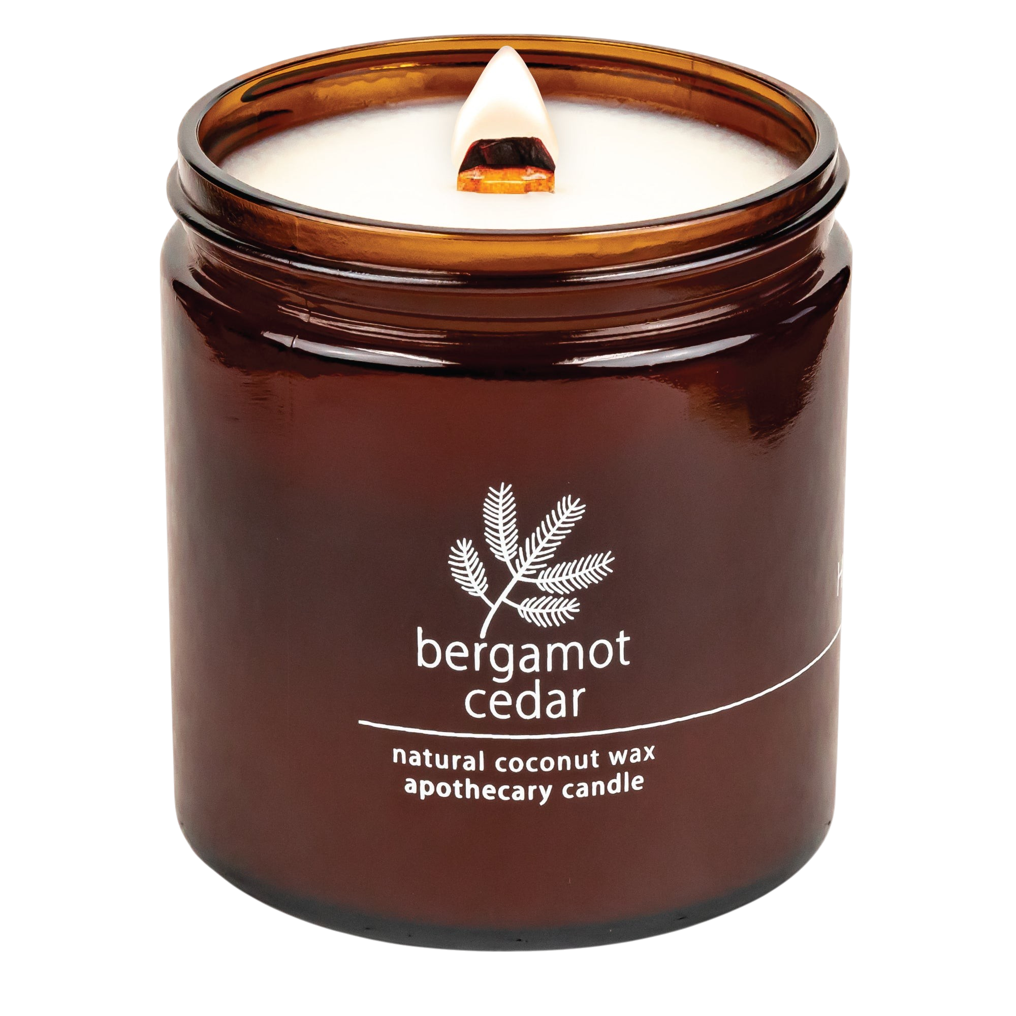 Hemlock Park Bergamot Cedar apothecary candle in an amber glass jar with a lit wooden wick and natural coconut wax.