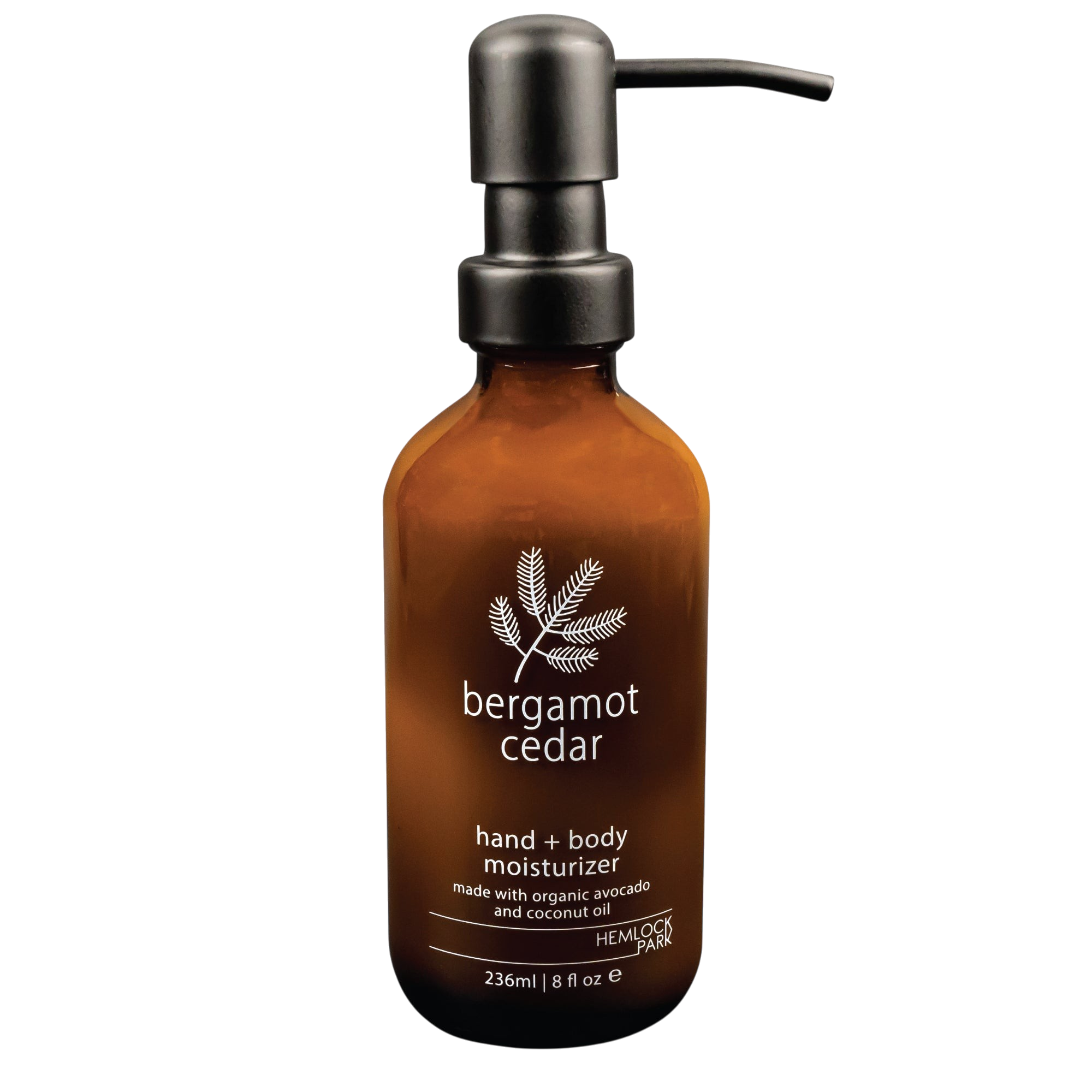Hemlock Park Bergamot Cedar hand and body moisturizer in an amber glass bottle with a black pump dispenser.