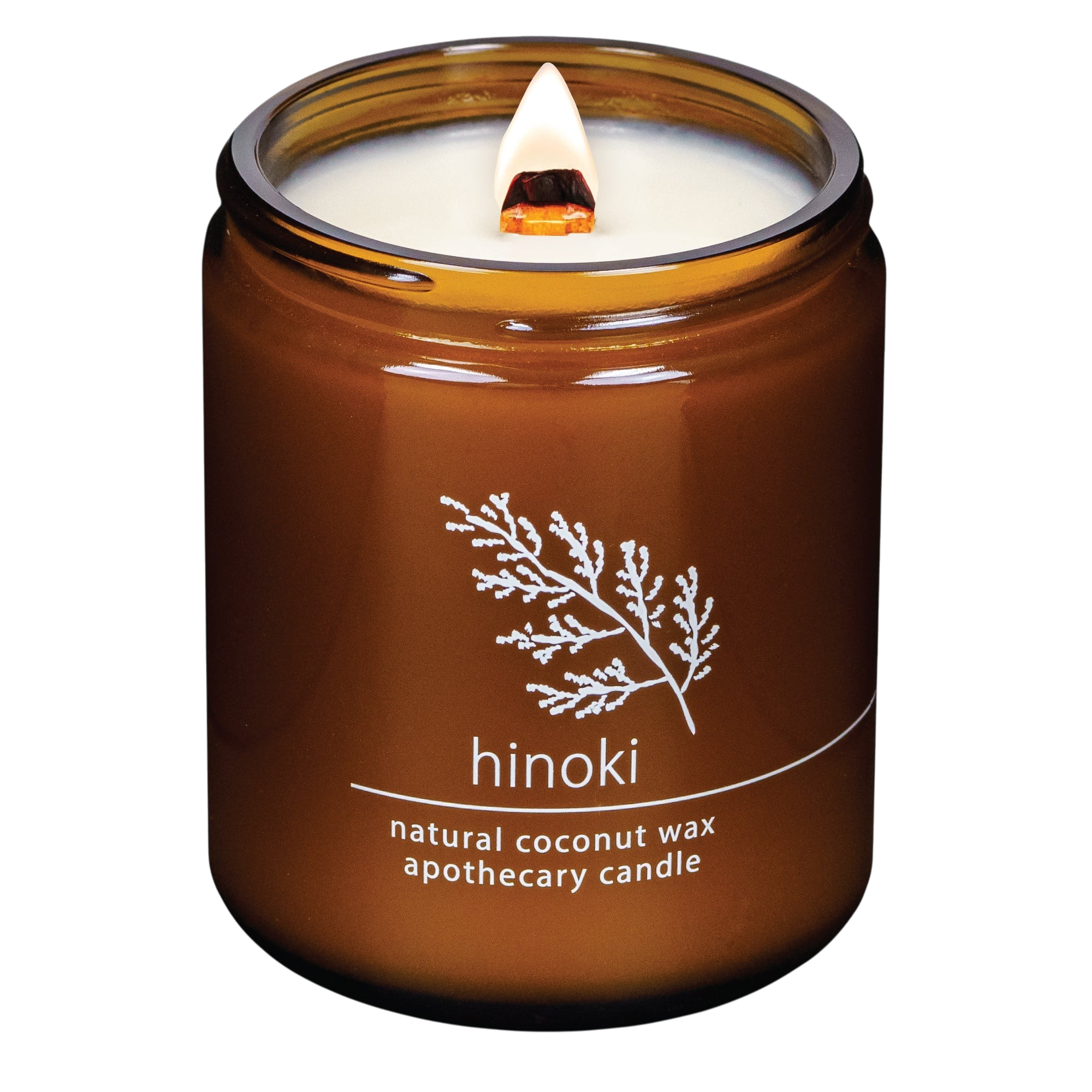 Hemlock Park Hinoki apothecary candle in an amber glass jar with a lit wooden wick and botanical label design