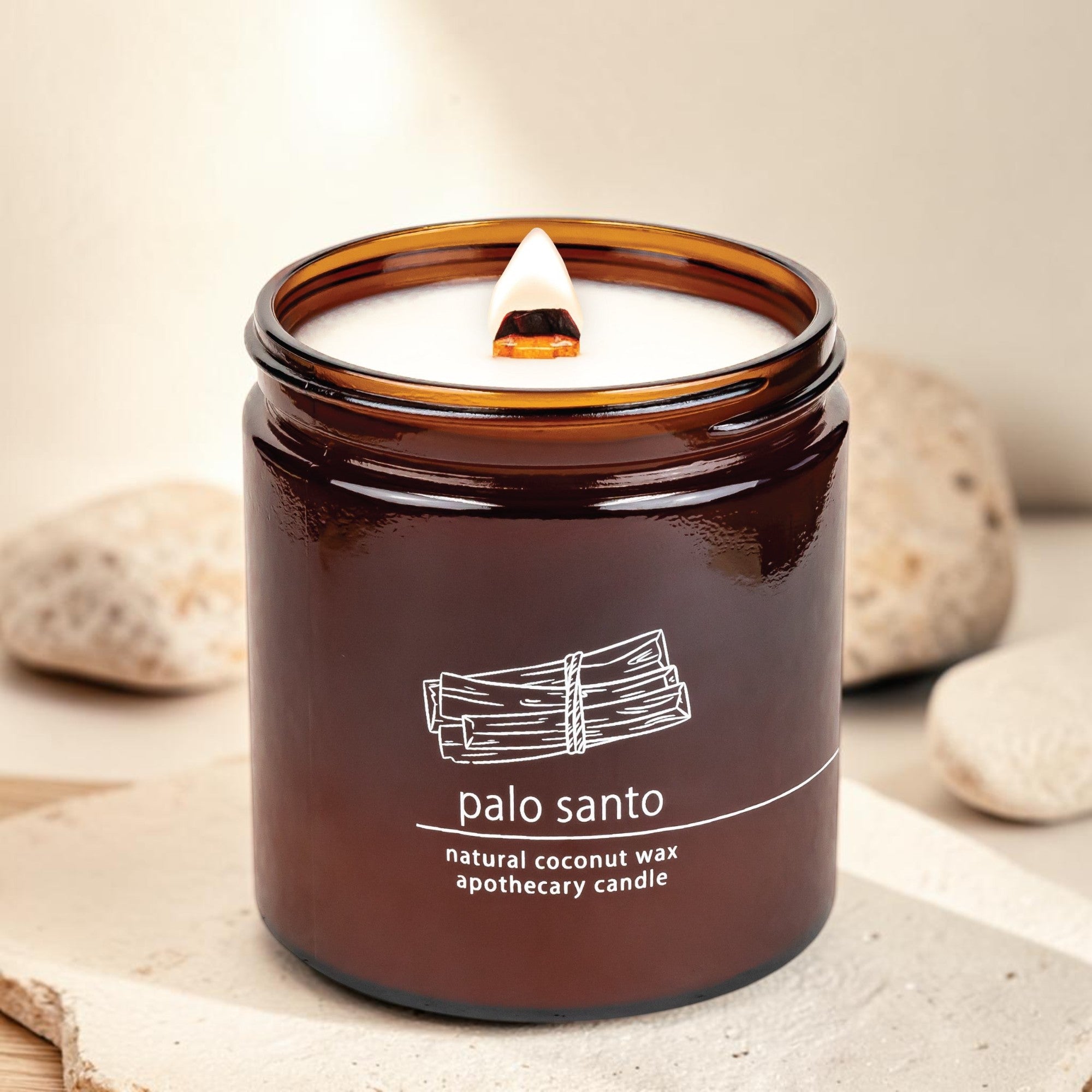 Hemlock Park Palo Santo apothecary candle in an amber glass jar with a natural coconut wax and wooden wick