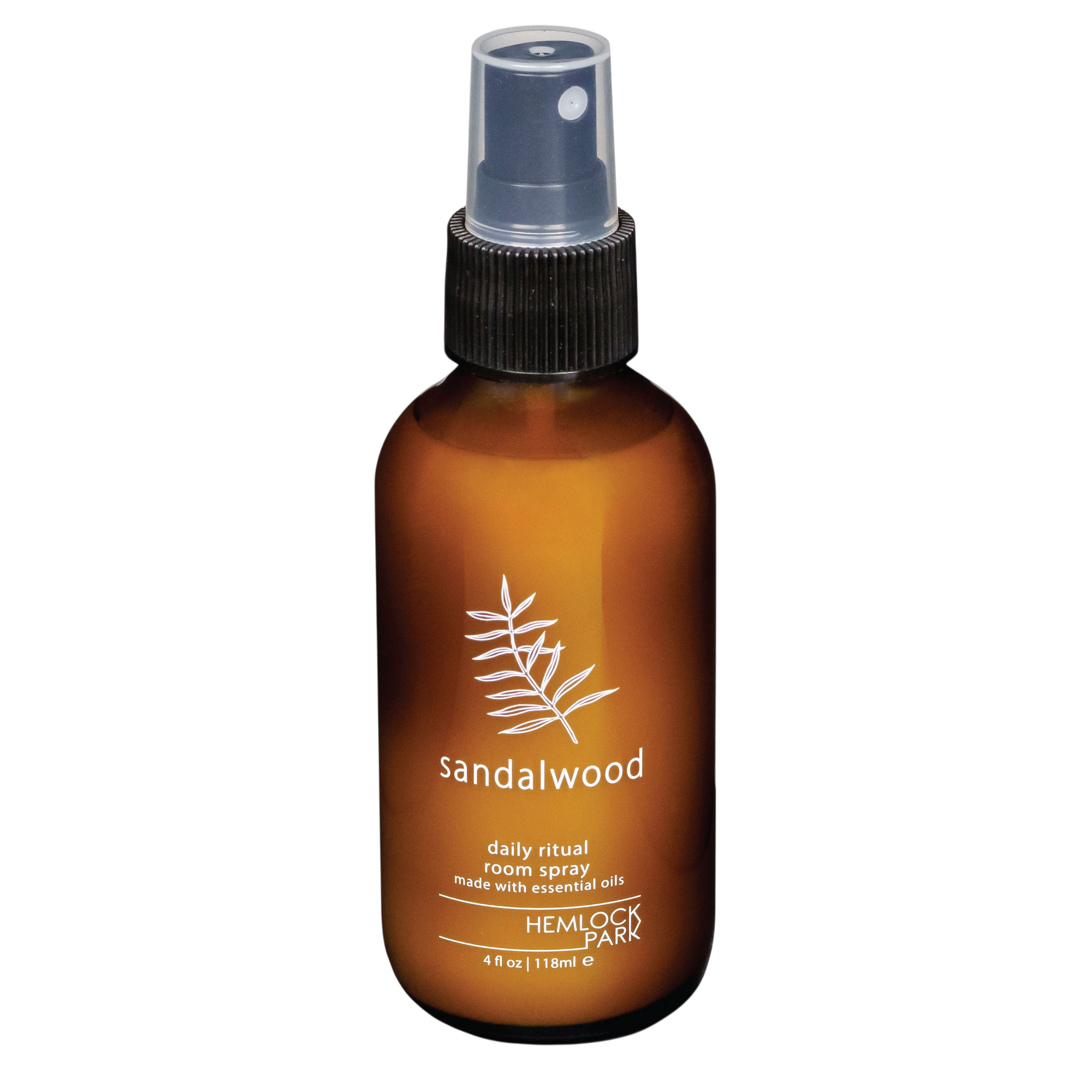 Hemlock Park Sandalwood room spray in an amber glass bottle with a black spray nozzle and botanical label design.