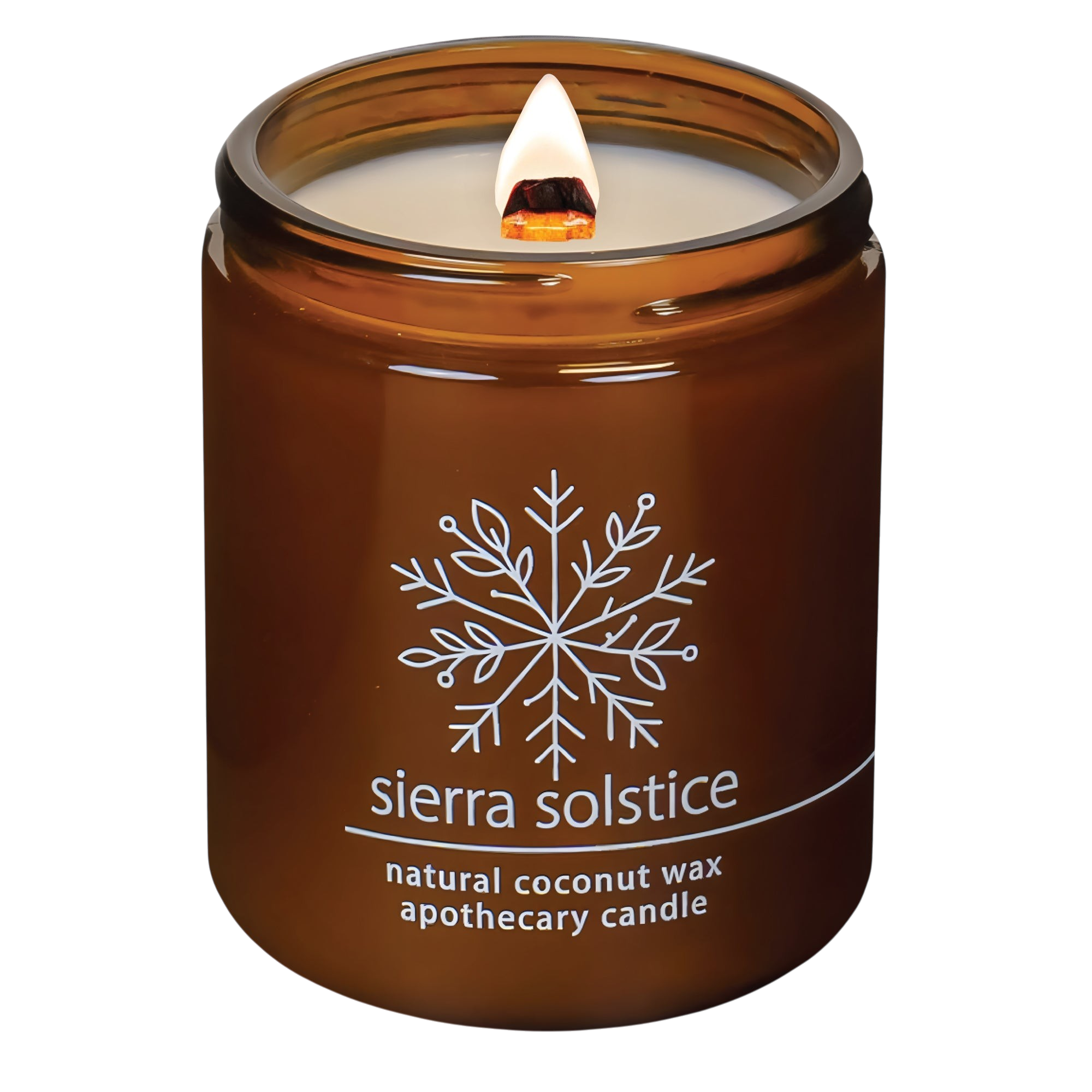 Hemlock Park Sierra Solstice apothecary candle in an amber glass jar with a lit wooden wick and snowflake logo.