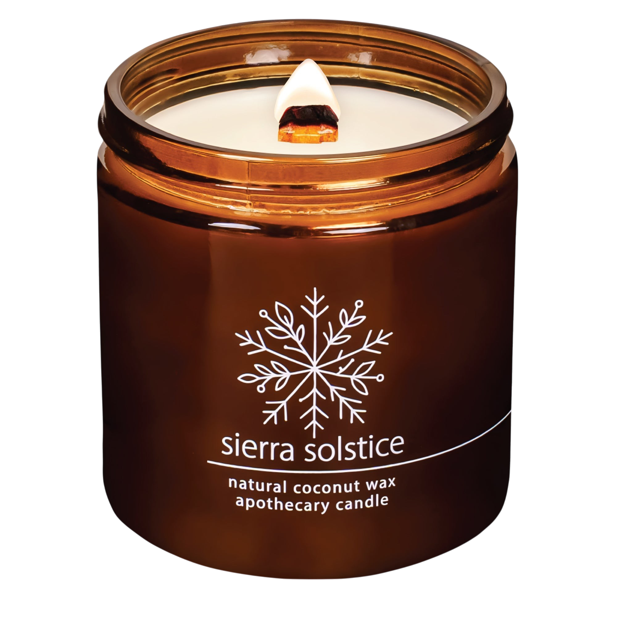 Hemlock Park Sierra Solstice apothecary candle in a brown glass jar with a wooden wick and snowflake label design.