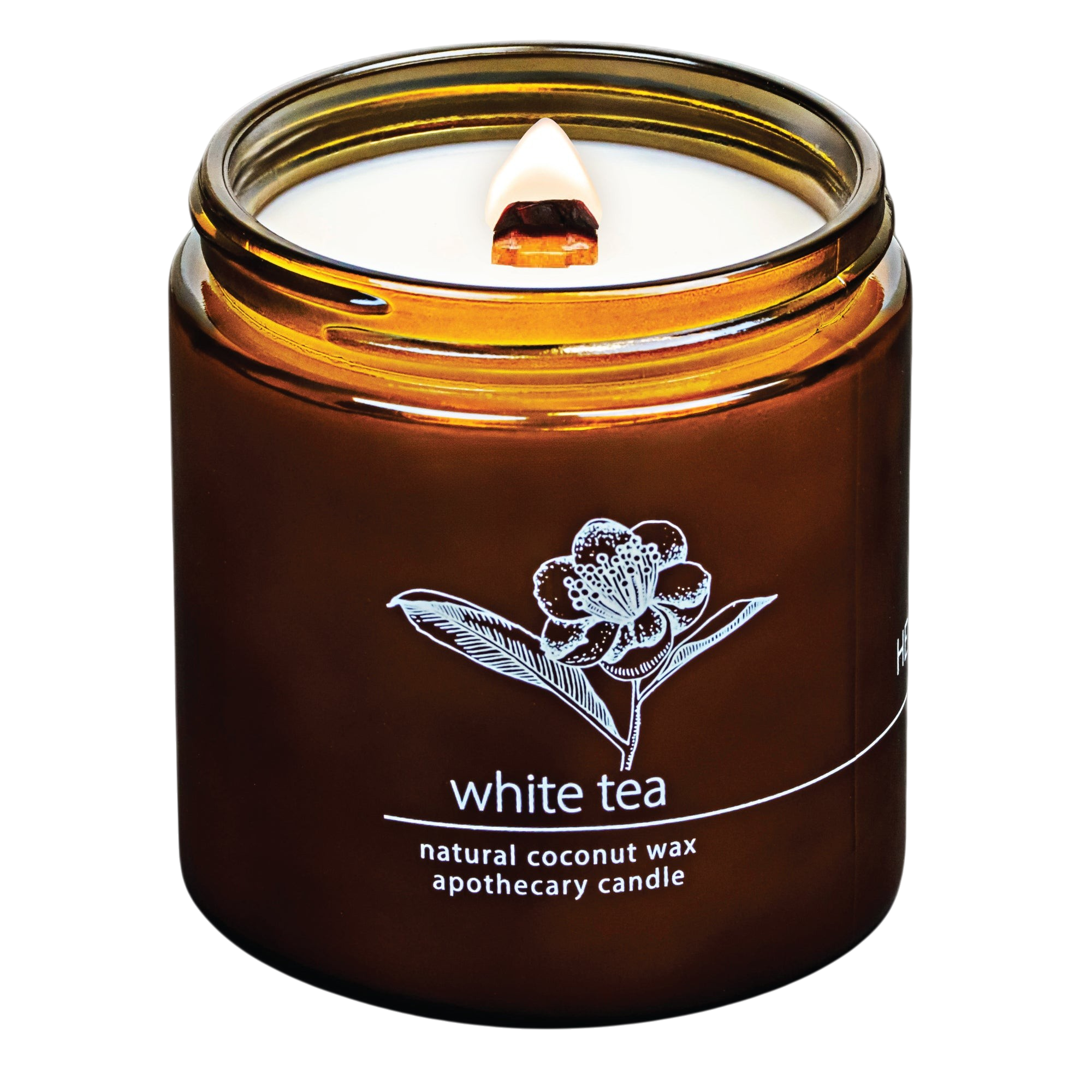 Hemlock Park White Tea apothecary candle in an amber glass jar with a crackling wooden wick and coconut wax.