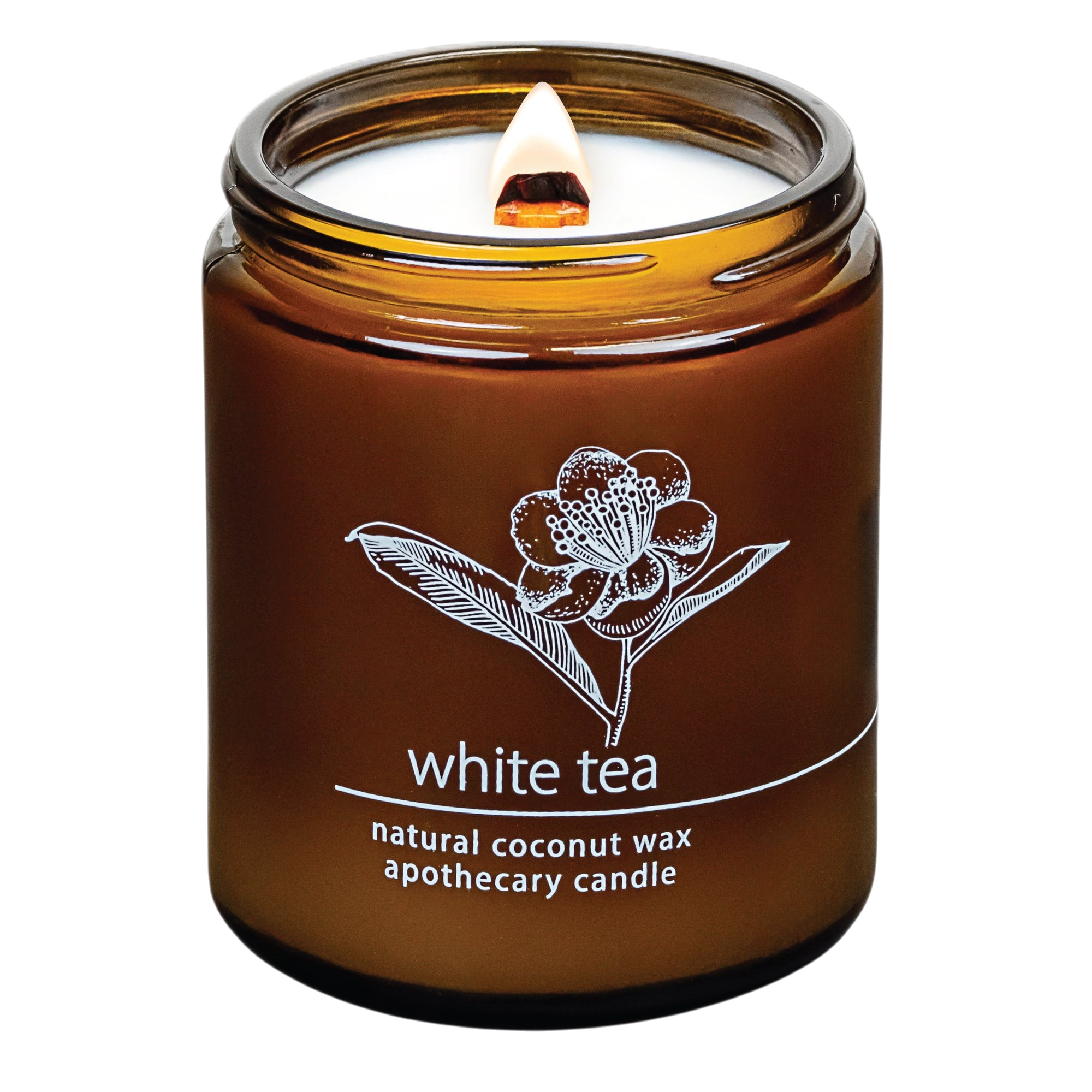 Hemlock Park White Tea apothecary candle in an amber glass jar with a lit crackling wooden wick and coconut wax.
